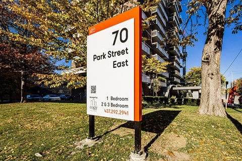 a sign for park street east in front of a building